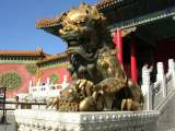 A gilded bronze lion in front of the Palace of Tranquil Longevity.